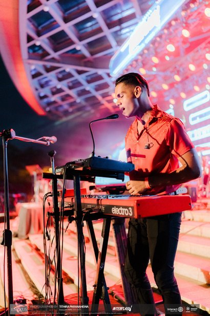Funk Island keyboardist singing during a live set