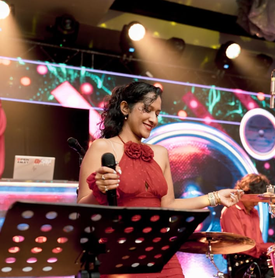 Dewakie Kotelawala singing live on stage with Funk Island